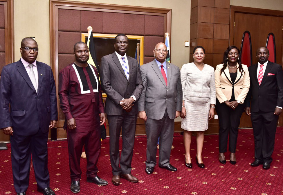 The delegation of Pan African Parliament MPs in a group photo with Zimbabwean Speaker, Jacob Francis Nzwidamililo Mudenda (centre) and Deputy Deputy Speaker of Parliament, Anita Among.