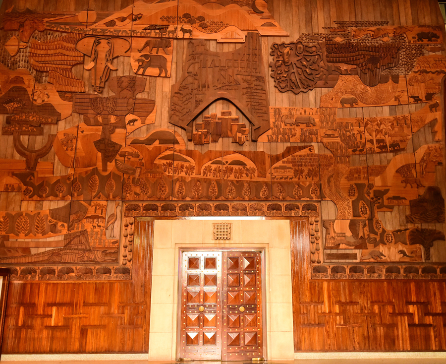 The wooden screen on one of the walls of the main Central Lobby of Parliament.
